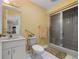 Well-lit bathroom featuring a glass-enclosed shower, a vanity, and neutral decor at 5282 Box Turtle Cir, Sarasota, FL 34232
