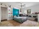 Comfortable bedroom with a blue accent wall, built-in shelves, and a ceiling fan for added comfort at 5282 Box Turtle Cir, Sarasota, FL 34232