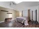 Spacious bedroom with wood floors, neutral tones, and a comfortable bed at 5282 Box Turtle Cir, Sarasota, FL 34232