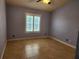 A bedroom with tile flooring, neutral paint, and a window providing natural light at 5346 Neil Dr, St Petersburg, FL 33714