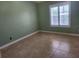 A bedroom with tile flooring, neutral paint and a window providing natural light at 5346 Neil Dr, St Petersburg, FL 33714