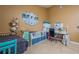 Bedroom featuring neutral walls, tile floors, a workspace with a desk, and a craft area at 5346 Neil Dr, St Petersburg, FL 33714
