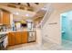 Stylish kitchen with stainless steel appliances, granite countertops, and open access to the living spaces at 5346 Neil Dr, St Petersburg, FL 33714
