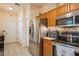 Bright kitchen with stainless steel appliances, updated cabinets, and seamless access to additional storage at 5346 Neil Dr, St Petersburg, FL 33714