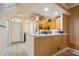 Entryway and kitchen space with stainless steel appliances and breakfast bar at 5346 Neil Dr, St Petersburg, FL 33714