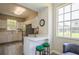Community space with a kitchenette and bar seating featuring neutral colors and stainless steel appliances at 5346 Neil Dr, St Petersburg, FL 33714