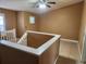 An upper-level landing featuring neutral paint, tile flooring, and a ceiling fan at 5346 Neil Dr, St Petersburg, FL 33714