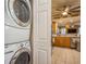 Convenient laundry closet with a stacked washer and dryer, located steps away from the kitchen at 5346 Neil Dr, St Petersburg, FL 33714