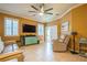 Bright living area featuring tile floors, ceiling fan, and exterior access at 5346 Neil Dr, St Petersburg, FL 33714