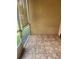 Enclosed patio featuring neutral-toned walls, patterned tile flooring, and a screened window for natural light and airflow at 5346 Neil Dr, St Petersburg, FL 33714