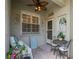 Cozy covered porch with seating and decor, a charming entry to the home at 5346 Neil Dr, St Petersburg, FL 33714