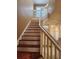 Staircase with wood treads, white risers, and banister leading to the upper level at 5346 Neil Dr, St Petersburg, FL 33714