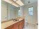 Bathroom featuring granite countertop, bronze sink, and tiled floors at 5533 Ashley Pkwy, Sarasota, FL 34241