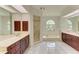 Bright bathroom featuring dual sinks, bathtub, and separate shower at 5533 Ashley Pkwy, Sarasota, FL 34241