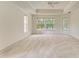Spacious bedroom with tray ceilings, large windows and carpet flooring at 5533 Ashley Pkwy, Sarasota, FL 34241