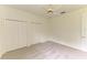 Bright bedroom featuring plush carpeting, ceiling fan, and spacious closets at 5533 Ashley Pkwy, Sarasota, FL 34241