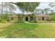 Beautiful one-story home with mature landscaping and tile roof at 5533 Ashley Pkwy, Sarasota, FL 34241