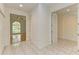 Hallway with tile flooring leading to various rooms at 5533 Ashley Pkwy, Sarasota, FL 34241