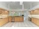 Spacious kitchen with tile floors, wooden cabinets, and stainless steel appliances at 5533 Ashley Pkwy, Sarasota, FL 34241