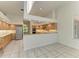 Bright kitchen boasts stainless steel appliances and generous cabinet space at 5533 Ashley Pkwy, Sarasota, FL 34241