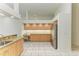 Bright and spacious kitchen with stainless steel fridge and breakfast nook at 5533 Ashley Pkwy, Sarasota, FL 34241
