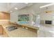 Gourmet kitchen offers granite countertops and views of the screened-in pool at 5533 Ashley Pkwy, Sarasota, FL 34241