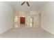 Open living area with tile floors, large windows, and a chandelier at 5533 Ashley Pkwy, Sarasota, FL 34241