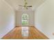 Living room with hardwood floors and large window at 5533 Ashley Pkwy, Sarasota, FL 34241