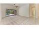 Spacious living room with patio access and neutral carpet flooring at 5533 Ashley Pkwy, Sarasota, FL 34241