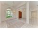 Open living space with large windows, tile floor, and chandelier lighting at 5533 Ashley Pkwy, Sarasota, FL 34241