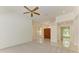 Bright living room features tile floors and an elegant front door entrance at 5533 Ashley Pkwy, Sarasota, FL 34241