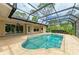Cool off and relax in this kidney-shaped pool and enjoy its inviting outdoor space at 5533 Ashley Pkwy, Sarasota, FL 34241