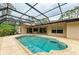 Enjoy this beautiful kidney-shaped pool with a screened-in lanai and brick pavers at 5533 Ashley Pkwy, Sarasota, FL 34241