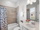 Bathroom with shower-tub combo and a single sink vanity at 603 165Th E St, Bradenton, FL 34212