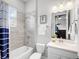 Bright bathroom with shower-tub combo and single sink vanity at 603 165Th E St, Bradenton, FL 34212