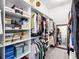 Organized walk-in closet with custom shelving and hanging space at 603 165Th E St, Bradenton, FL 34212