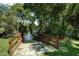 Community kayak trail entrance through lush foliage and trees at 6231 Cypress Bend Ct, University Park, FL 34201