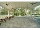 Community pavilion with picnic tables and chairs for outdoor enjoyment at 6231 Cypress Bend Ct, University Park, FL 34201