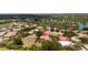 Beautiful home with a terracotta roof nestled in a lush, green community with lake views at 6231 Cypress Bend Ct, University Park, FL 34201