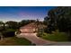 Charming single-story home featuring a three-car garage, lush landscaping, and a brick driveway at 6231 Cypress Bend Ct, University Park, FL 34201