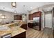 Stylish kitchen with stainless steel appliances, custom cabinets, granite countertops, and ample space for cooking at 6231 Cypress Bend Ct, University Park, FL 34201