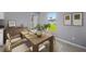 Cozy dining area with modern table and chairs, next to large window and open layout at 6384 Grayson St, Englewood, FL 34224