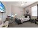 Bright bedroom with a cactus theme, a desk, a bed, and neon lights at 6523 Blue Grosbeak Cir, Lakewood Ranch, FL 34202