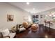 Comfortable seating area adjacent to a wet bar and sliding doors to a private pool at 6523 Blue Grosbeak Cir, Lakewood Ranch, FL 34202