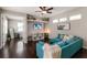 Spacious living room with a large window, comfortable seating, and stylish décor, perfect for Gathering gatherings at 6523 Blue Grosbeak Cir, Lakewood Ranch, FL 34202