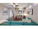 Inviting living room featuring a comfortable sectional sofa and built-in shelving at 6523 Blue Grosbeak Cir, Lakewood Ranch, FL 34202