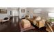 Inviting living room featuring hardwood floors, a stylish sofa, and decor; great for relaxing and entertaining at 6523 Blue Grosbeak Cir, Lakewood Ranch, FL 34202