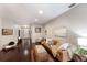 Inviting living room with hardwood floors, neutral paint, stylish furniture, and an open doorway to the entrance at 6523 Blue Grosbeak Cir, Lakewood Ranch, FL 34202