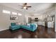 Well-lit living room with an open layout, seamlessly connected to the kitchen and dining area at 6523 Blue Grosbeak Cir, Lakewood Ranch, FL 34202