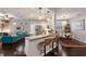 Open living space with a view of a gourmet kitchen, dining area, and living room at 6523 Blue Grosbeak Cir, Lakewood Ranch, FL 34202